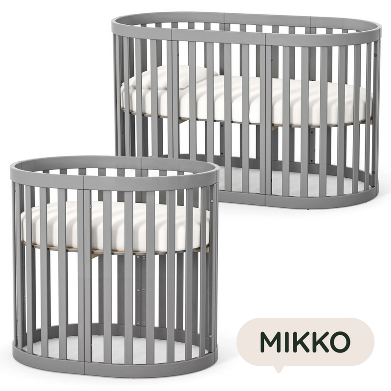 Lettino rotondo per neonati affiancabile al letto Mikko Gekko 140x70. Crescente – disponibile la funzione di trasformazione. Può essere dotata di ruote oppure di meccanismo a dondolo per cullare il bambino. Colore grigio