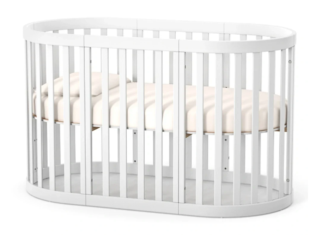 Lettino rotondo per neonati affiancabile al letto Mikko Gekko 140x70. Crescente – disponibile la funzione di trasformazione. Può essere dotata di ruote oppure di meccanismo a dondolo per cullare il bambino. Colore beige
