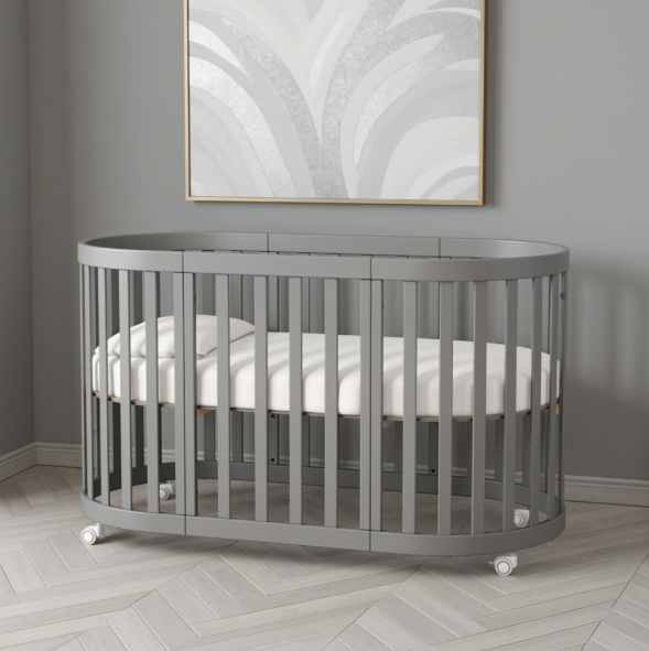 Lettino rotondo per neonati affiancabile al letto Mikko Gekko 140x70. Crescente – disponibile la funzione di trasformazione. Può essere dotata di ruote oppure di meccanismo a dondolo per cullare il bambino. Colore grigio